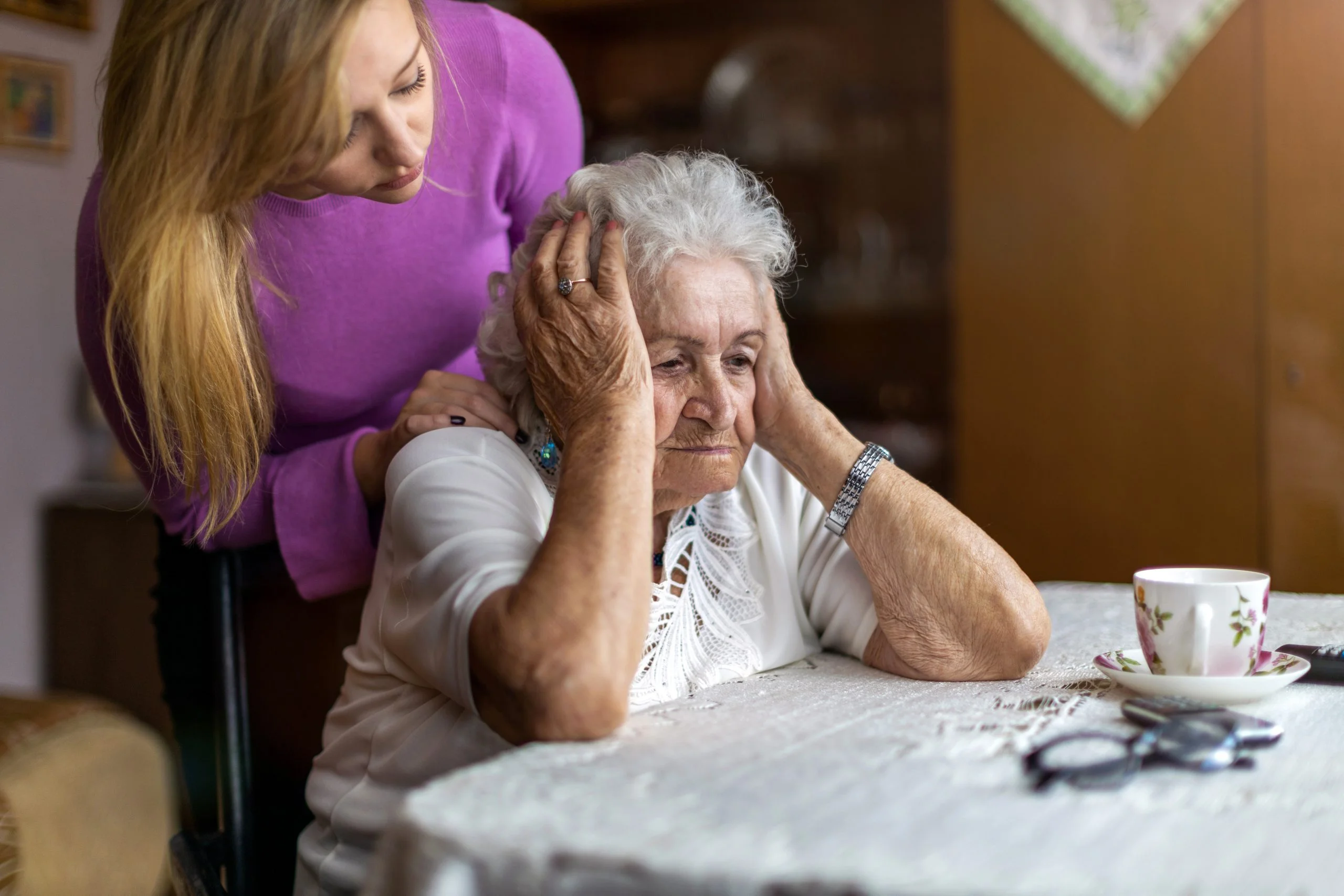 Senior worker consoling her elderly patient Senior Worker Consoling Her Elderly Patient